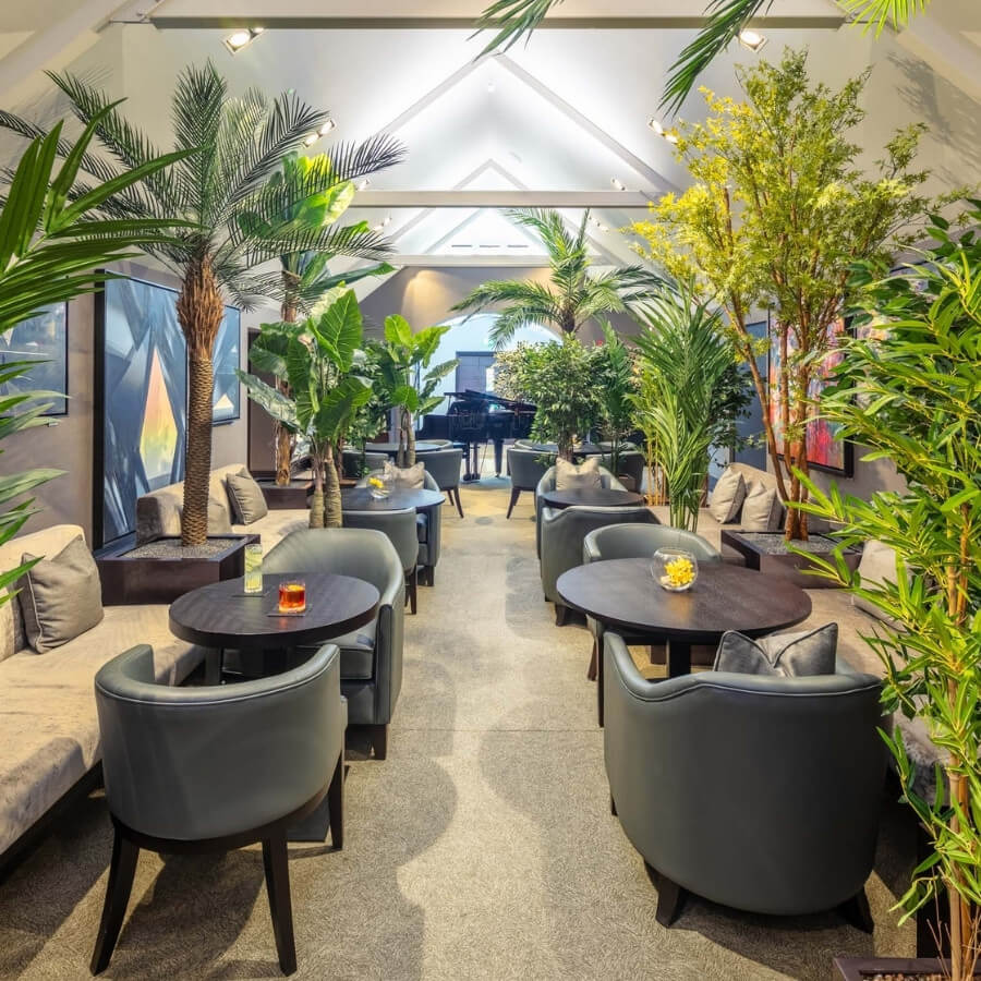 oriel lounge at twr y felin hotel St David's. Surrounded with contemporary art work and grand piano